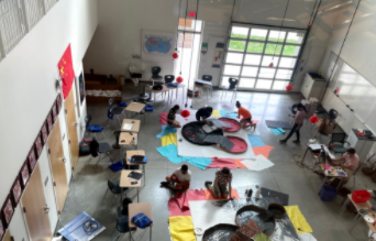 Students engage in coding and robotics activities.